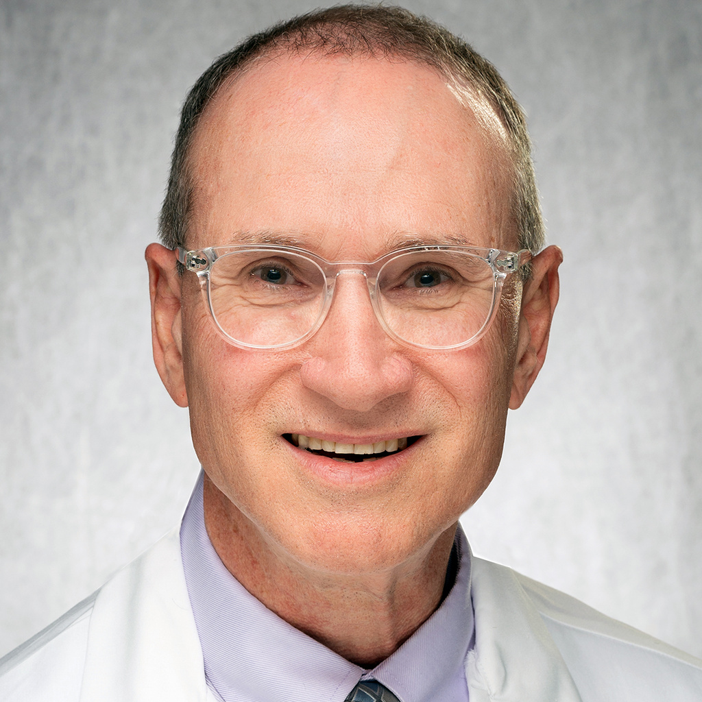 Middle-aged caucasion gentleman in white lab coat