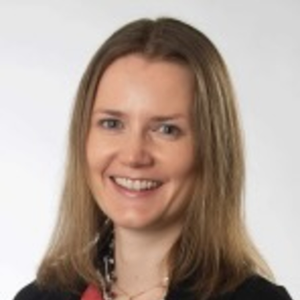 photo of woman with dark blonde hair and light eyes wearing a black jacket