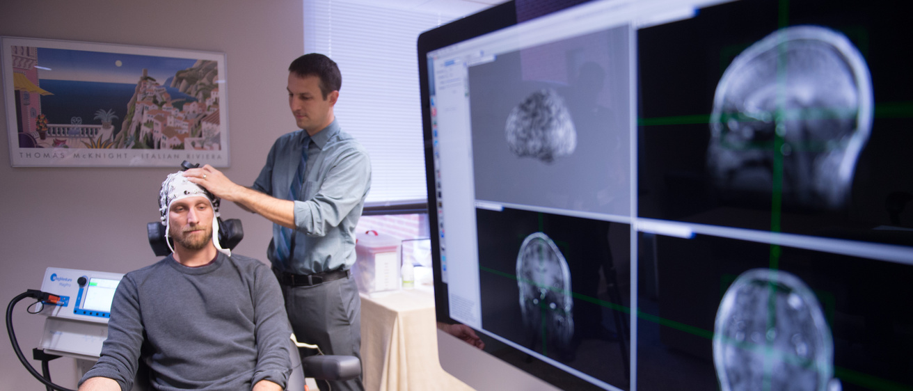 photo of Brain stimulation cap and monitors