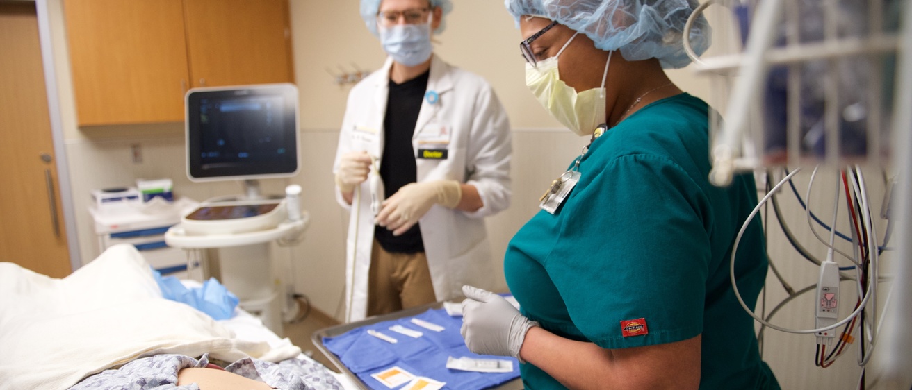 Photo of patient and clinicians prepping for procedure